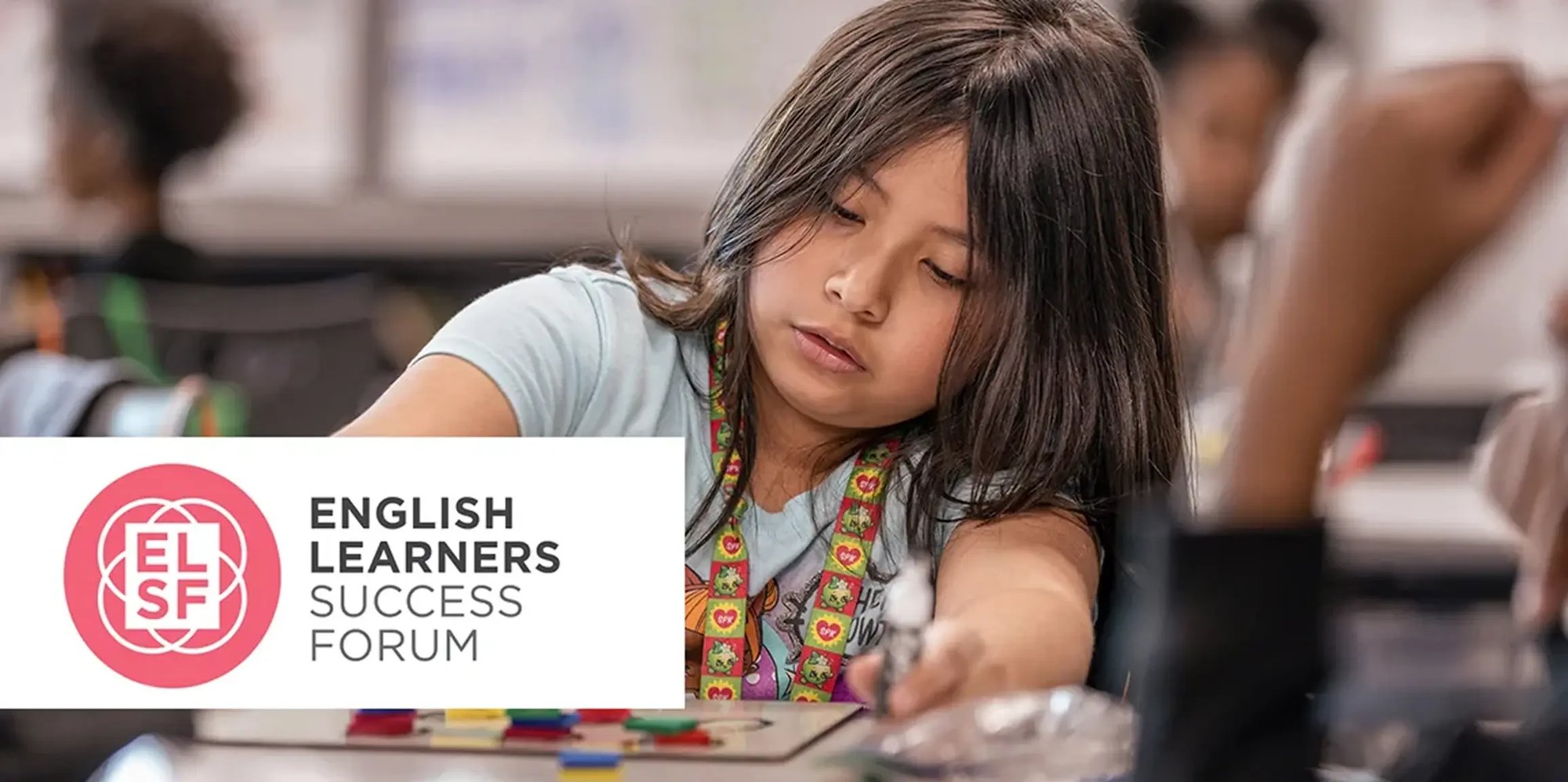 A multilingual learner working in class, endorsed by the English Learners Success Forum