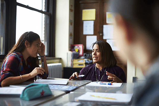 Teacher+working+with+student