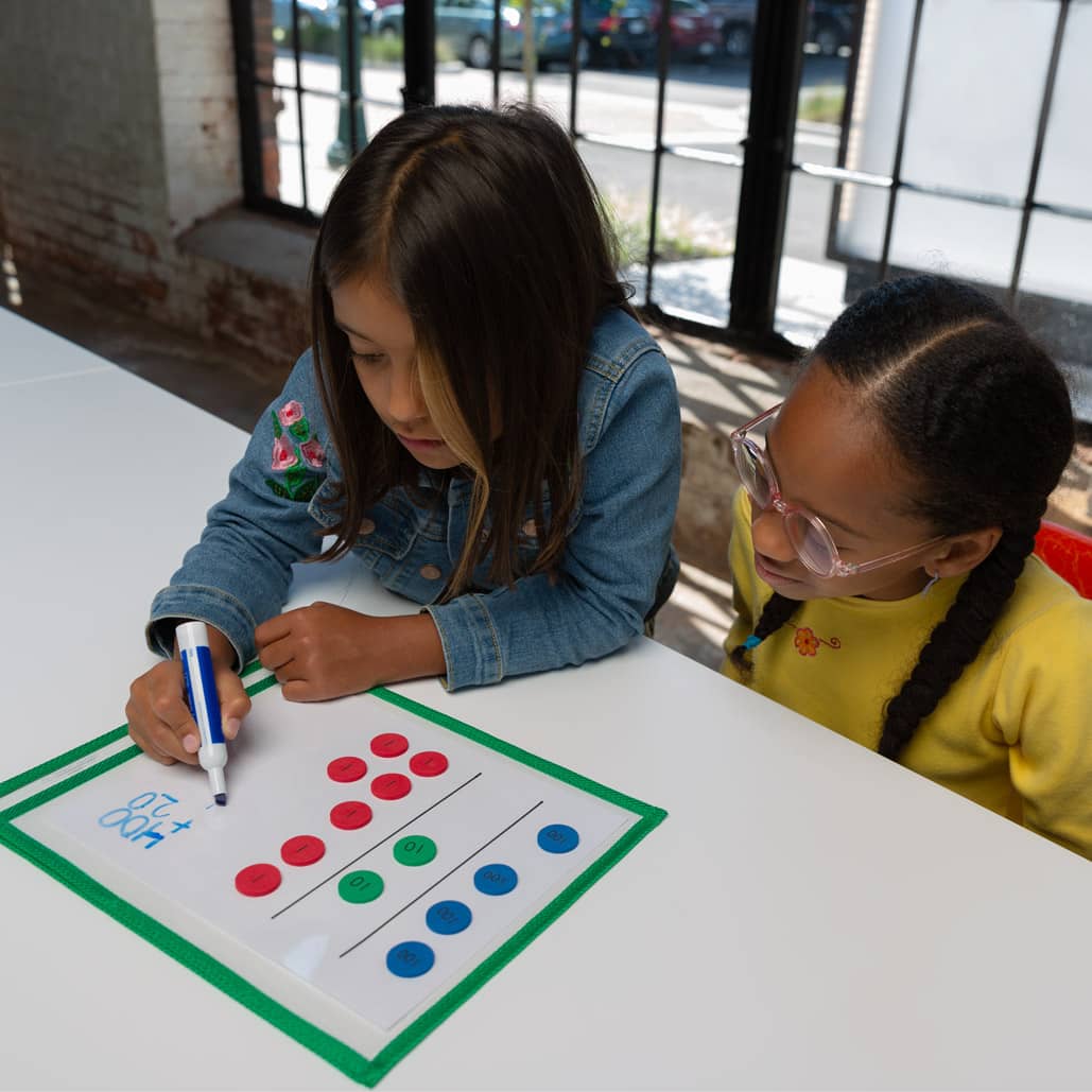 Eureka Math 2 Student Girls using place value disks